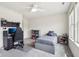 A tidy bedroom with gaming setup and neutral grey carpeting at 3645 Conifer Dr, Zionsville, IN 46077