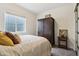 Cozy bedroom featuring a large window and a stylish wardrobe enhancing the comfortable atmosphere at 3645 Conifer Dr, Zionsville, IN 46077