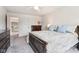A bedroom with a ceiling fan, neutral carpet, and access to another room at 3645 Conifer Dr, Zionsville, IN 46077