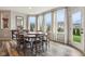 Dining area with wooden table, bay window, and natural lighting at 3645 Conifer Dr, Zionsville, IN 46077