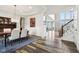 Open-concept dining room adjacent to living spaces, with natural light at 3645 Conifer Dr, Zionsville, IN 46077