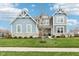 Beautiful two-story home featuring stone accents and a well-manicured lawn at 3645 Conifer Dr, Zionsville, IN 46077
