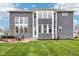 Stunning home exterior with a spacious backyard, a stylish patio area and plenty of green space at 3645 Conifer Dr, Zionsville, IN 46077