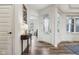 Bright foyer features hardwood floors, stylish decor, and an inviting entrance at 3645 Conifer Dr, Zionsville, IN 46077