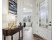 Inviting foyer with hardwood floors, elegant decor, and natural light at 3645 Conifer Dr, Zionsville, IN 46077