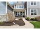 Inviting front porch with comfortable seating and stone accents at 3645 Conifer Dr, Zionsville, IN 46077