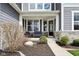 Cozy front porch featuring comfortable seating and a beautifully landscaped walkway at 3645 Conifer Dr, Zionsville, IN 46077