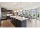 Bright kitchen with large island, pendant lighting, stainless appliances, and breakfast nook with bay windows at 3645 Conifer Dr, Zionsville, IN 46077