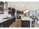 Well-equipped kitchen with stainless steel appliances, a large island, and generous counter space for cooking at 3645 Conifer Dr, Zionsville, IN 46077