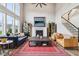 Airy living room with a fireplace, large windows, and stylish furniture for comfortable lounging at 3645 Conifer Dr, Zionsville, IN 46077