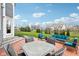 Inviting outdoor patio features ample seating, perfect for entertaining and enjoying the backyard view at 3645 Conifer Dr, Zionsville, IN 46077