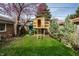 Charming backyard featuring a custom-built treehouse with a slide, perfect for Gathering fun at 3652 N Delaware St, Indianapolis, IN 46205