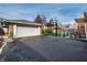 Long driveway leads to the detached garage, basketball hoop, and patio dining area at 3652 N Delaware St, Indianapolis, IN 46205