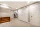 Finished basement features neutral carpet, closet, stairs, and a decorative wood shelving unit at 3652 N Delaware St, Indianapolis, IN 46205