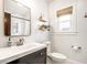 Bathroom with white subway tile in the shower, stylish vanity, and wood-look blinds at 3652 N Delaware St, Indianapolis, IN 46205