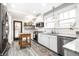 Beautiful kitchen with white subway tile backsplash, granite counters, stainless appliances, and a wooden island at 3652 N Delaware St, Indianapolis, IN 46205