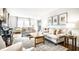 Spacious living room with a piano, comfortable sofas, and bright natural light at 3652 N Delaware St, Indianapolis, IN 46205