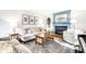 Bright and cozy living room with comfortable seating and a fireplace at 3652 N Delaware St, Indianapolis, IN 46205