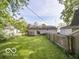 Spacious backyard featuring a deck, fenced perimeter, and plenty of room for outdoor activities at 428 E Trevor St, Brownsburg, IN 46112