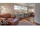 Comfortable bedroom featuring a lounge chair, a workspace, and mirrored closet doors at 428 E Trevor St, Brownsburg, IN 46112