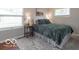 Comfortable bedroom featuring a queen bed, soft rug, and natural light from the window at 428 E Trevor St, Brownsburg, IN 46112