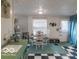 Cozy dining area with a round table, white chairs, and natural light from a nearby window at 428 E Trevor St, Brownsburg, IN 46112