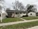 Front exterior of a charming single-story home with a well-maintained lawn and inviting curb appeal at 428 E Trevor St, Brownsburg, IN 46112