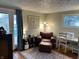 Comfortable sitting room with natural light, stylish decor, and access to an outdoor deck at 428 E Trevor St, Brownsburg, IN 46112