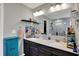 Bathroom featuring a dual sink vanity, modern lighting, and a walk-in shower at 4345 Maize Ln, Whitestown, IN 46075