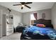 Bedroom featuring a ceiling fan, a bed, and a comfy beanbag chair for relaxation at 4345 Maize Ln, Whitestown, IN 46075