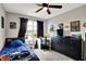A themed bedroom featuring a single bed, comic artwork, and dark curtains for a cozy atmosphere at 4345 Maize Ln, Whitestown, IN 46075