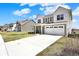 Traditional two-story home featuring a two-car garage and neutral-colored siding at 4345 Maize Ln, Whitestown, IN 46075