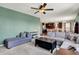 Spacious living room boasts an open layout, connecting to the kitchen, with neutral tones and a modern sofa at 4345 Maize Ln, Whitestown, IN 46075