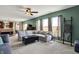 Open-concept living room with a large sectional sofa, neutral tones, and abundant natural light at 4345 Maize Ln, Whitestown, IN 46075
