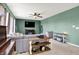 Comfortable living room featuring a ceiling fan, large sectional sofa, and stylish decor at 4345 Maize Ln, Whitestown, IN 46075