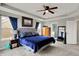 Bright main bedroom with a plush bed, modern decor, and an ensuite bathroom view at 4345 Maize Ln, Whitestown, IN 46075