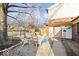 Charming backyard area with gravel and seating arrangement centered around a fire pit at 4814 Lynton Ct, Indianapolis, IN 46254