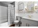 Elegant bathroom with floral wallpaper, gold accents, and a stylish vanity for a luxurious experience at 4814 Lynton Ct, Indianapolis, IN 46254