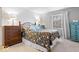 Comfortable bedroom with dual dressers, natural light, and tasteful decor for a peaceful retreat at 4814 Lynton Ct, Indianapolis, IN 46254