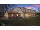 Charming two-story home featuring a brick facade, complemented by a well-manicured lawn and inviting outdoor space at 4814 Lynton Ct, Indianapolis, IN 46254