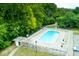 Overhead view of a community pool with plenty of lounge chairs and a bath house at 4814 Lynton Ct, Indianapolis, IN 46254