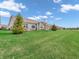 Lush backyard with manicured lawn and inviting outdoor seating area at 4993 Silverbell Dr, Plainfield, IN 46168