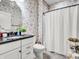 Bathroom featuring wallpaper, a shower curtain, and a vessel sink at 4993 Silverbell Dr, Plainfield, IN 46168