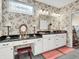 Bright bathroom with granite counters, floral wallpaper, and a vanity area at 4993 Silverbell Dr, Plainfield, IN 46168