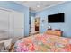 Comfortable bedroom features a mounted television, closet, and view of an en suite at 4993 Silverbell Dr, Plainfield, IN 46168