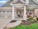 Inviting front porch with rocking chair, brick accents, and walkway leading to the front door at 4993 Silverbell Dr, Plainfield, IN 46168
