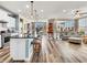 Open-concept kitchen and living area with island seating and plenty of natural light at 4993 Silverbell Dr, Plainfield, IN 46168