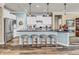 Bright kitchen with stainless appliances, white cabinets, large island, and bar stool seating at 4993 Silverbell Dr, Plainfield, IN 46168