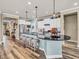 Modern kitchen with island, breakfast bar, and stainless steel appliances at 4993 Silverbell Dr, Plainfield, IN 46168