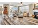 Cozy living room featuring a fireplace, ceiling fan, and lots of natural light at 4993 Silverbell Dr, Plainfield, IN 46168